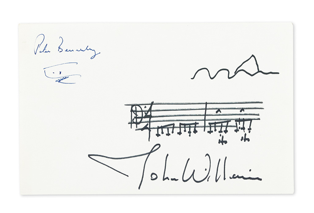 WILLIAMS, JOHN; AND PETER BENCHLEY. Autograph Musical Quotation Signed with a small ink drawing, both by Williams, and a small ink draw